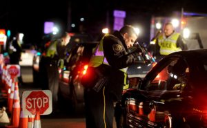 cop checking license at a dui checkpoint in bucks county pa